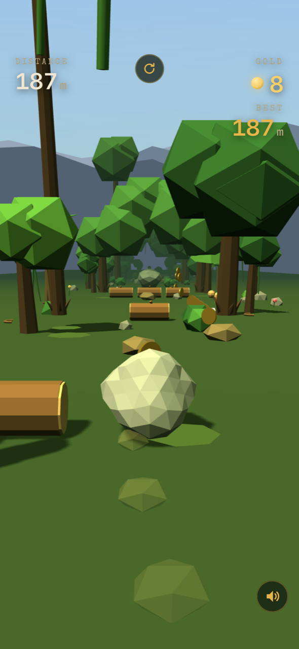 Gameplay — the boulder barreling past logs and trees